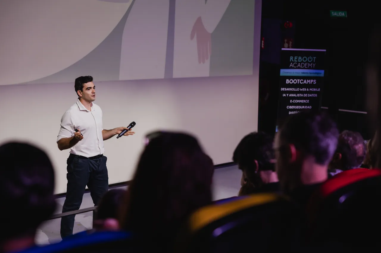 Luis Sosa speaking to an audience at a Reboot Academy conference